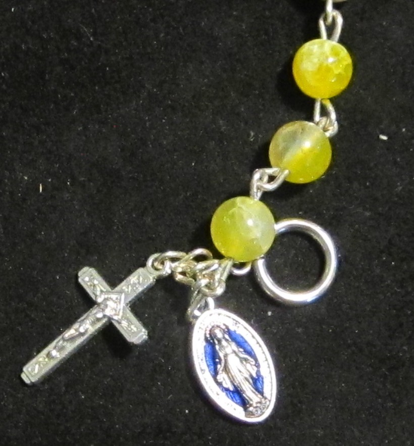 Yellow Quartz Rosary Bracelet crucifix and medal detail on black background
